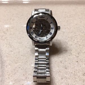 Skeleton watch stainless links